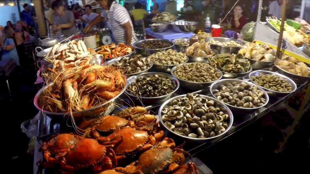 Various snails and seafood prepared in different styles